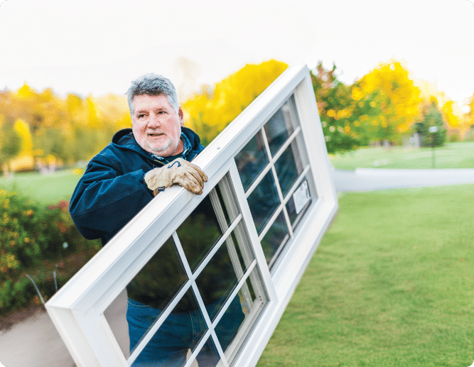 Window Nation installer carrying in new fiberglass window